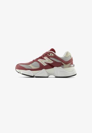New Balance sneakers in maroon and beige, featuring a mesh and suede upper, thick white midsole, and a black rubber outsole.