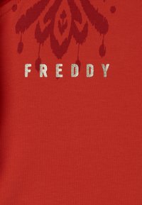 Freddy CON CAPPUCCIO E DETTAGLI SET - Tuta - poppy red  total eclipse