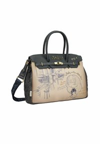 Schwarze und beigefarbene Handtasche mit strukturiertem Oberflächen, die eine Comic-Zeichnung zeigt, goldene Akzente und zwei Griffe hat. Abnehmbarer Schultergurt enthalten.