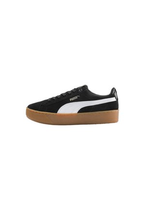 Baskets Puma noir et blanc avec semelle en gomme, à lacets sur le devant, et logo Puma sur le côté, présentées en vue de profil sur un fond blanc.
