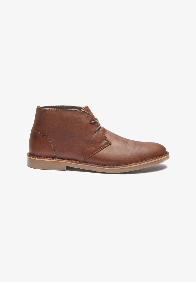 Brown leather ankle boots with a sleek design, featuring a simple lace, rounded toe, and rubber sole. Smooth texture with stitched accents.