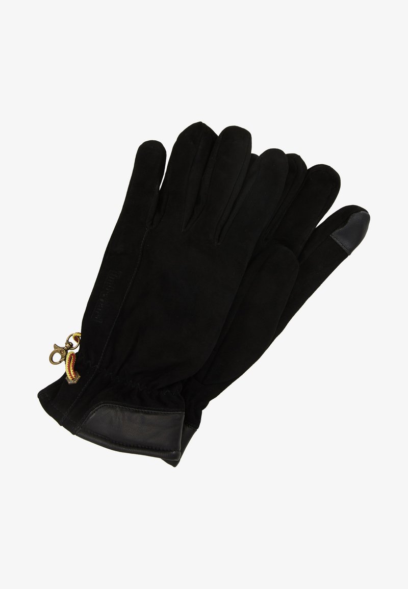 Schwarze Handschuhe aus Wildleder, mit einem glatten Lederakzent an den Fingerspitzen und einem Metallclip mit einem bunten Band am Handgelenk.