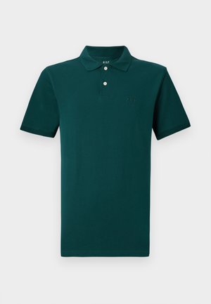 Dark green short-sleeve polo shirt with two buttons and a folded collar, featuring subtle GAP logo embroidered on the chest and inside neck.