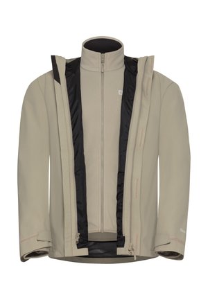 Beige Softshell-Jacke mit durchgehendem Reißverschluss, innerem grauem Fleece-Futter und schwarzen Akzenten; verfügt über verstellbare Bündchen und Netz-Taschen.