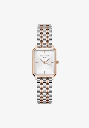 Montre rectangulaire argent et or rose avec un cadran blanc, affichant un motif texturé, des index horaires minimalistes et un bracelet métallique bicolore.