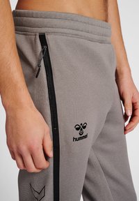 Hummel CIMA XK PANTS - Jogginghose - grey melange