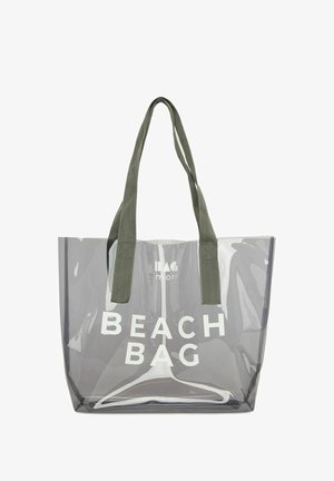 Sac de plage en PVC gris transparent avec des poignées en tissu vert. Il comporte un texte blanc en gras "SAC DE PLAGE" imprimé sur le devant. Design rectangulaire simple.