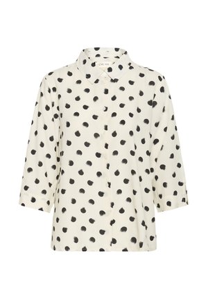Gräddfärgad blus med svart prickmönster, knäppning fram och krage. Har trekvartsärmar och en avslappnad passform. Mjuk tygkänsla.