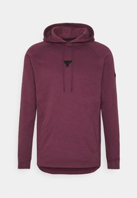 Sudadera color burdeos con un logo de toro negro, cuello con cordones, bolsillos laterales y puños acanalados. Textura suave con un dobladillo trasero más largo.