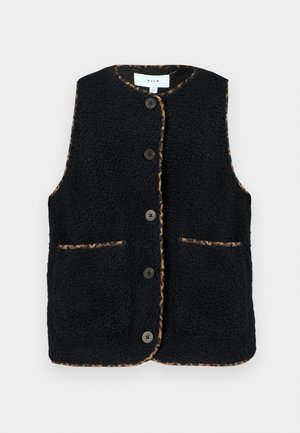 Melna vilnas veste ar apaļu kakla izgriezumu, priekšējiem kabatām un piecām pogām. Malas rotā leopardu raksts, pievēršot uzmanību detaļām.