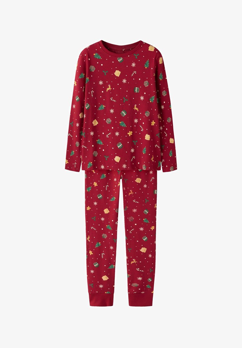 Ensemble comprenant un haut à manches longues rouge et un pantalon, orné de motifs de Noël tels que des arbres, des cannes en sucre, des tambours, des rennes, des maisons en pain d'épice, des flocons de neige et du houx.