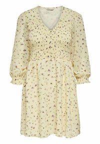 Kukkamekko vaaleankeltaisena, joissa on smockattu yläosa, V-pääntie ja puffattuja hihoja. Sisältää pieniä violetteja ja vihreitä kukkakuosisia yksityiskohtia kauttaaltaan.