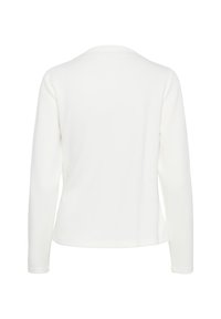 Chemise blanche à manches longues avec un col rond, vue de dos, présentant une texture de tissu simple et lisse.