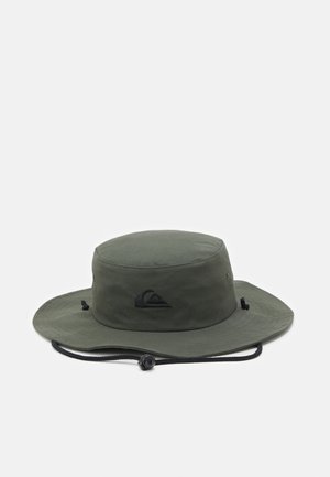 Green bucket hat with a rounded crown, wide brim, and black logo. Features a drawstring for adjustable fit and smooth, matte fabric texture.