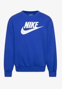 Niebieska bluza z bawełnianego materiału, z białym logo Nike z przodu, prążkowanymi mankietami i dołem. Klasyczny krój z okrągłym dekoltem.