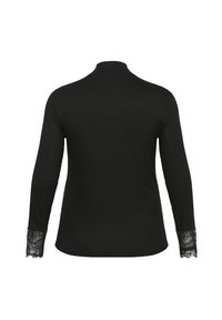 Top nero a maniche lunghe con collo alto. Tessuto a coste su tutta la superficie e bordo in pizzo sui polsini. Design semplice e attillato.