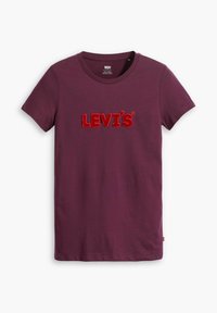 Lila kortärmad T-shirt från Levi's med röd texturerad logotyp centrerad på bröstet, rund halsringning och liten röd etikett på vänster söm.
