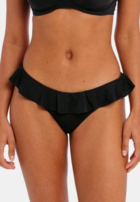 Black bikini bottoms with a ruffled trim along the waist, made from smooth material, featuring a minimalistic design and curved shape.