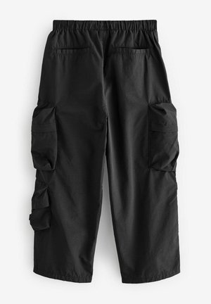 Black cargo pants with an elastic waistband, two side pockets, and two large cargo pockets on the thighs. Smooth, lightweight material.