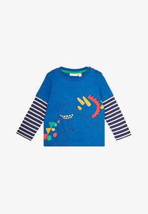 Blå toddler langærmet skjorte med hvide og marineblå stribede ærmer, med farverige dinosaur-illustrationer og skulderknapper på venstre side.