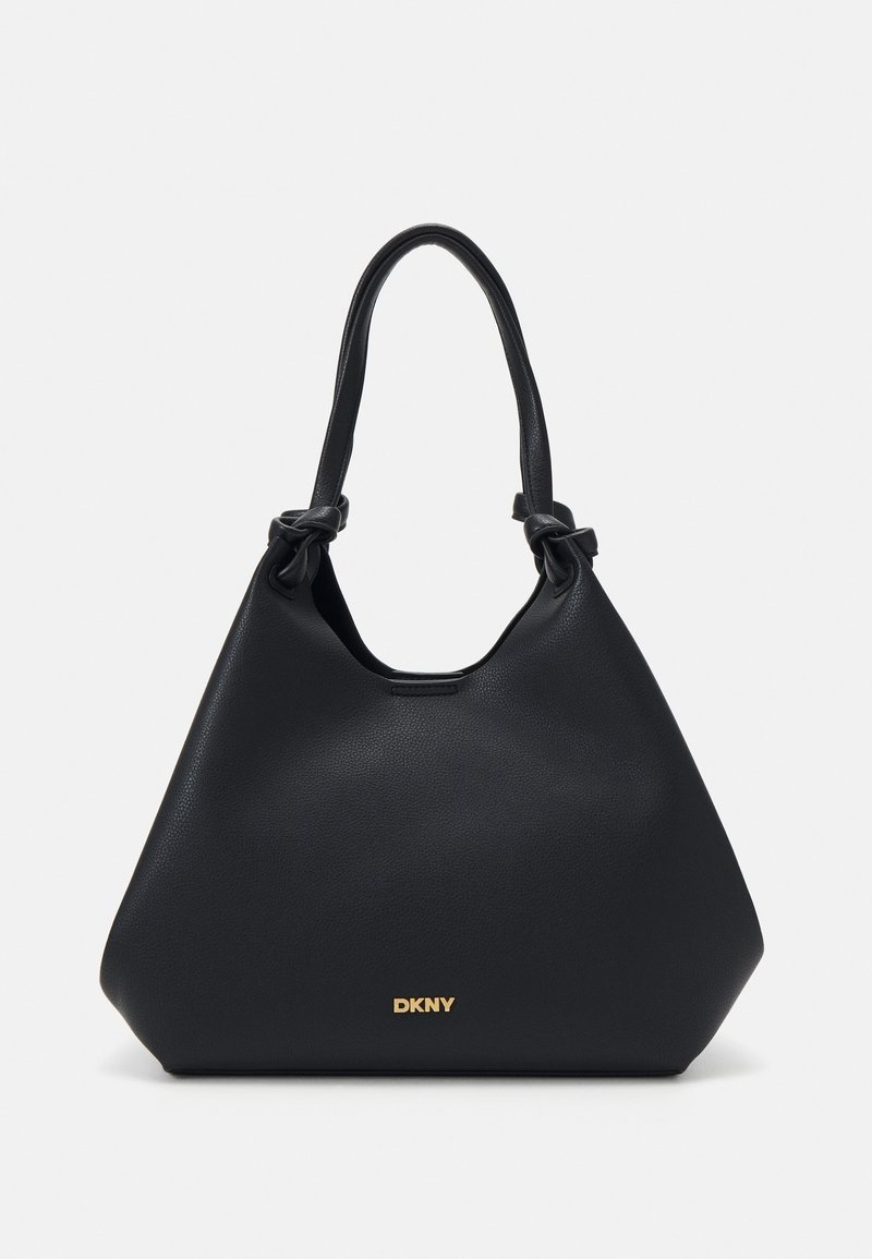 Black leather tote bag with a textured finish, knotted handle accents, and gold logo detail at the base. Features a slouchy silhouette.