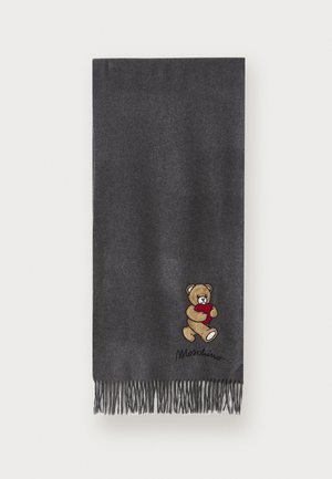 Charcoal gray scarf made from soft fabric, featuring fringe edges and an embroidered bear holding a red heart. Designer logo displayed beneath.