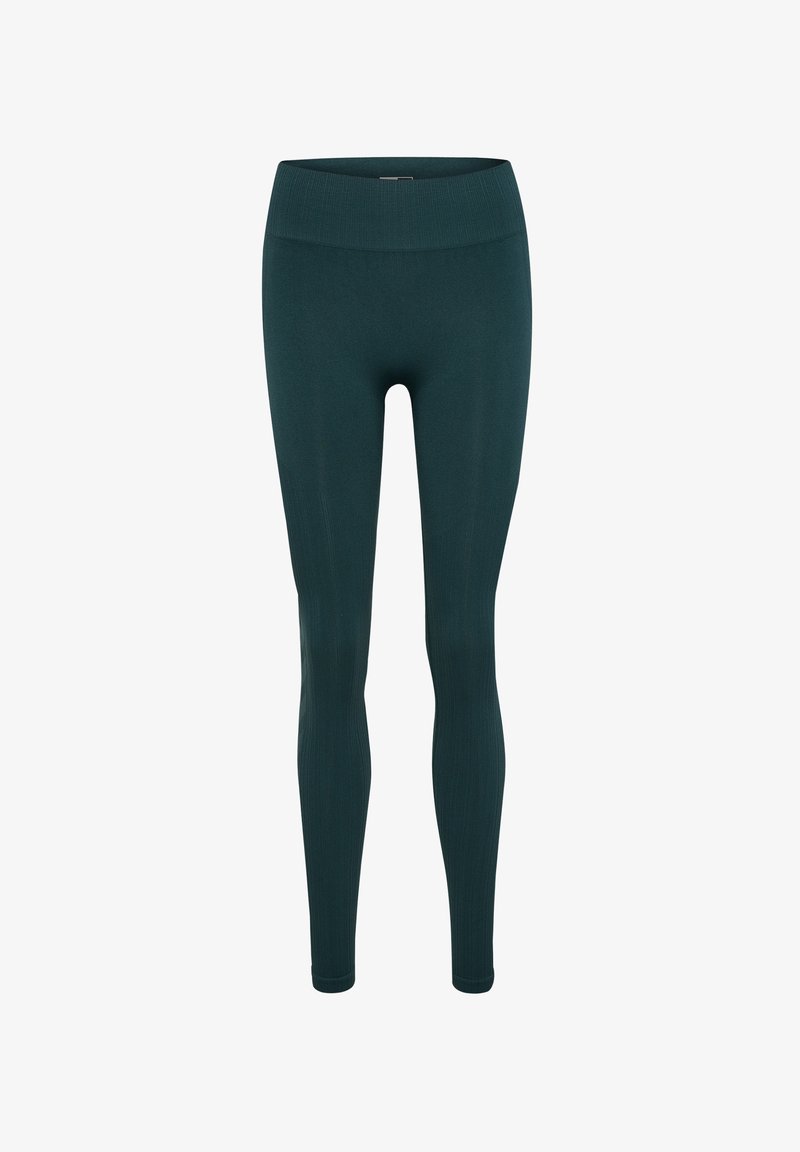 Mörk teal leggings med en figurnära design, hög ribbad midja och slät textur. Perfekta för aktivt eller avslappnat bruk.