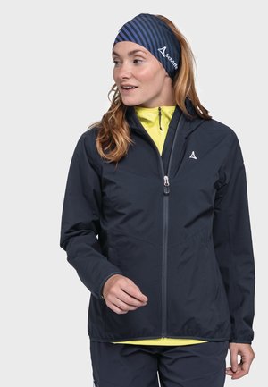 Navy waterproof jacket with a full zip, light yellow inner layer, and side pockets. Features a logo on the left chest and a streamlined design.