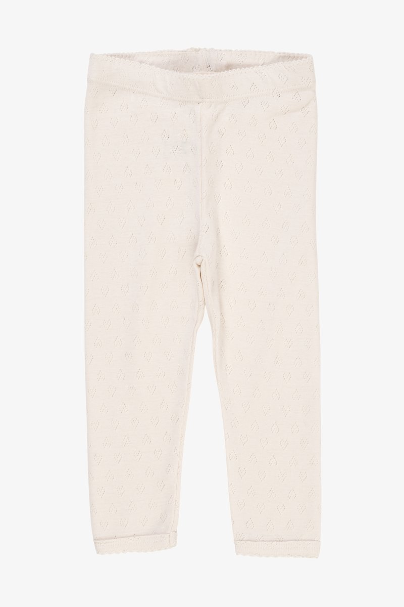 Kremfargede leggings laget av teksturert stoff med et subtilt diamantmønster, med elastisk midje og bølget kant.