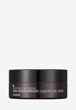 Conteneur noir rond avec une finition brillante, présentant un texte blanc indiquant "Masque pour les yeux au collagène intensif à l'or pour le soin des cernes" et des informations produit.