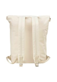 Sac à dos de couleur crème avec deux bretelles ajustables, fermeture à zip et texture lisse. Il présente un design minimaliste sans motifs visibles.