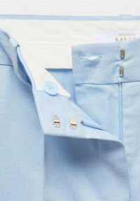 Light blue fabric with a smooth texture, featuring a white waistband, button closure, and metal hook accents. Side zipper opening included.