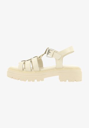 Beige platform sandals with multiple straps, buckled ankle closure, and textured sole. Material appears synthetic with a smooth finish.