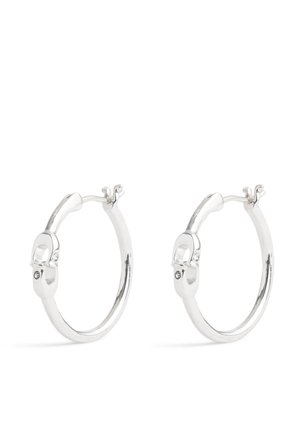 Silver hoop earrings featuring a smooth, rounded design with a locking clasp. Notable small accents near the closure.