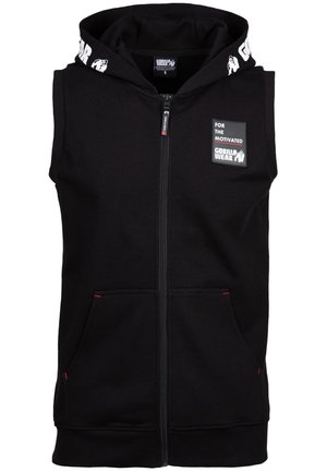 Black sleeveless zip-up hoodie, made of soft fabric, featuring a two-tone drawstring hood, front pockets, and a logo patch with text.