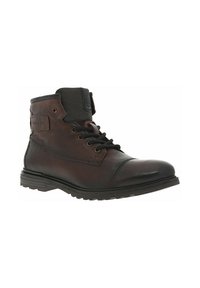 Bottines en cuir marron avec col en textile noir, bout rond, œillets métalliques et semelle en caoutchouc. Présente un patch logo sur le côté.