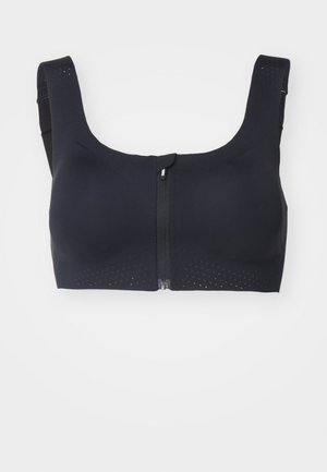 Black sports bra with wide straps, front zip, and perforated detailing for breathability. Smooth fabric with a structured design.