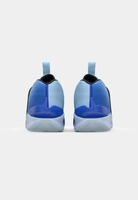Blue athletic shoes featuring a textured design, gradient color from light to dark blue, and black accents. Smooth sole with a pull tab.