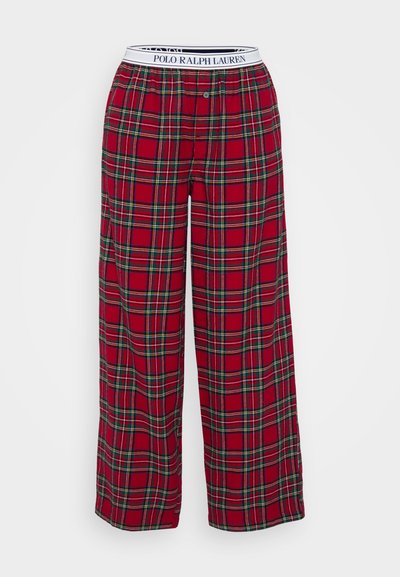 Piros kockás nadrág, laza vágással, fehér derékszíjjal, amelyen a "POLO RALPH LAUREN" felirat szerepel, valamint gombos záródással.