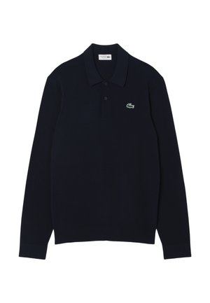 Polo a maniche lunghe navy realizzato in morbido cotone con colletto, caratterizzato da un piccolo logo ricamato di un coccodrillo verde sul petto.