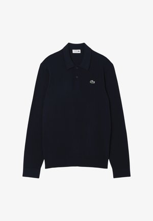 Polo a maniche lunghe navy realizzato in morbido cotone con colletto, caratterizzato da un piccolo logo ricamato di un coccodrillo verde sul petto.