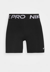 Mustat urheilushortsit joustavasta materiaalista, leveällä vyötärönauhalla, jossa on "NIKE PRO" -brändäys ja pieni valkoinen swoosh-logo.
