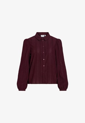 Blouse boutonnée violet foncé avec un motif subtil en dentelle, manches longues bouffantes et col classique.