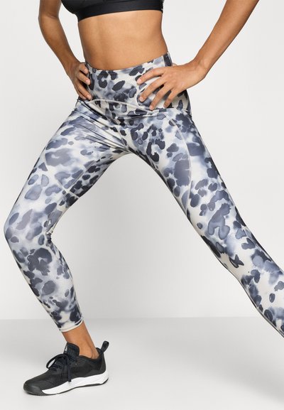 High-waisted, form-fitting leggings in a smooth, stretchy fabric with a gray and black leopard print pattern. Seam detailing along the legs.