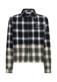 Camicia a scacchi in bianco e nero con accenti gialli, design cropped, chiusura con bottoni frontale e testo ricamato sul petto. Realizzata in materiale flanella.