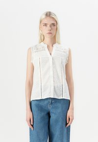 Weiße ärmellose Bluse aus leichtem Stoff mit strukturierten Pünktchen und Spitzenbesatz, Knopfleiste und einer lockeren Passform.