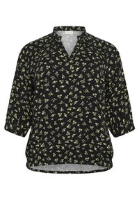 Blouse noire avec un décolleté en V, des manches 3/4 et un motif floral en jaune clair. Coupe ample et tissu léger avec un ourlet légèrement arrondi.