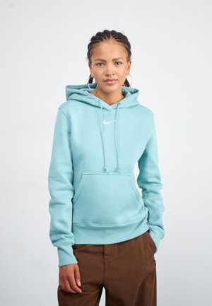 Tirkīza kapuce ar priekšējo kabatu un auklām. Uz krūtīm ir balts Nike logo. Gluda kokvilnas maisījuma audums.
