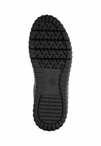 Semelle de chaussure en caoutchouc noir avec des rainures profondes, des motifs en zigzag et des sections texturées pour une meilleure adhérence et durabilité.