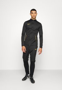 Nike Performance M NK DRY ACD21 TRK SUIT K - Fato de treino - black/laser orange